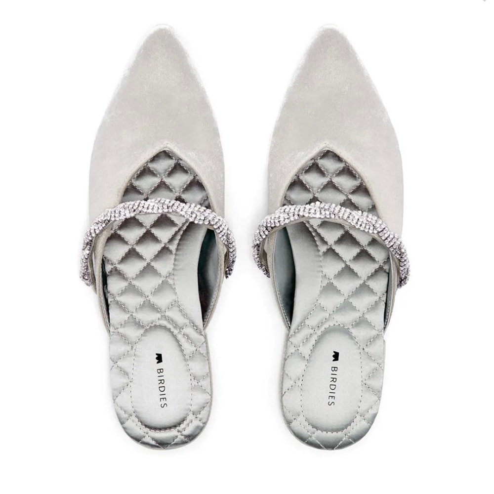 The Swan Snow Crystal Bracelet pointed-toe slides.